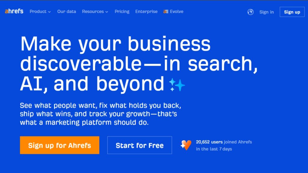 Ahrefs homepage with slogan ‘Make your business discoverable—in search, AI, and beyond’ highlighting SEO and marketing platform features.