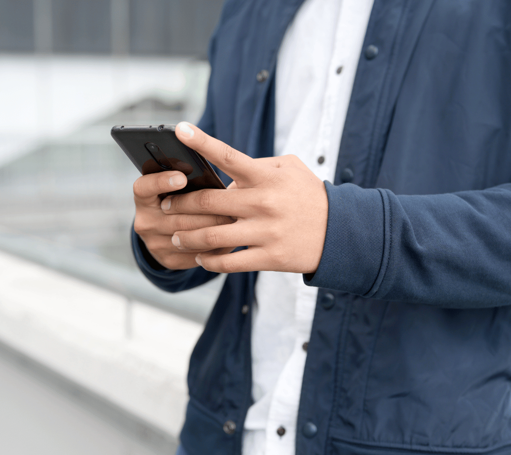 man texting with his local business