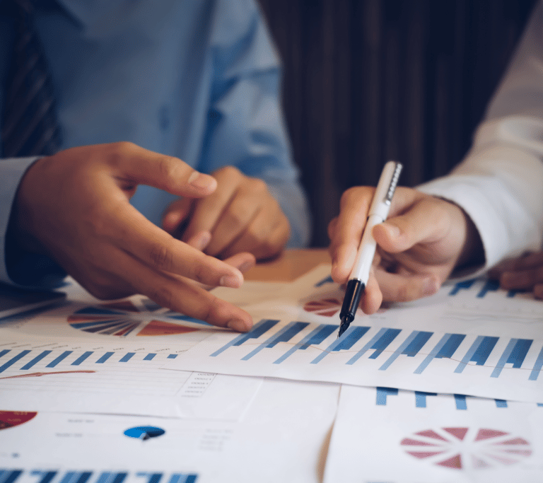 two people looking at income charts